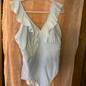 Lovely blue and white striped seersucker swimsuit. Sweet ruffled V-neck front